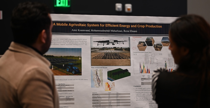 Photo depicts a poster describing a mobile agrivoltaic crop production system.