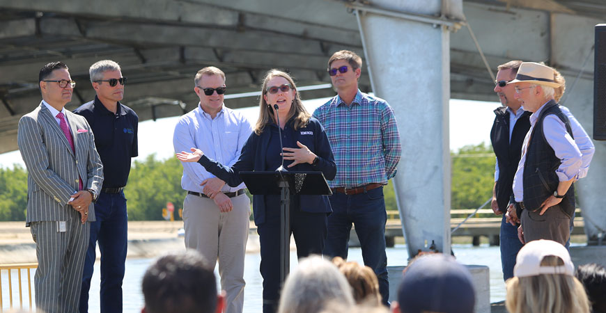 UC Merced researcher Brandi McKuin speaks at a podium during the Project Nexus event.