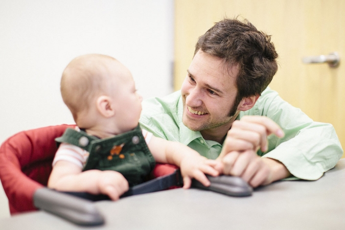 Professor Eric Walle with one of the subjects of his study of child language development.