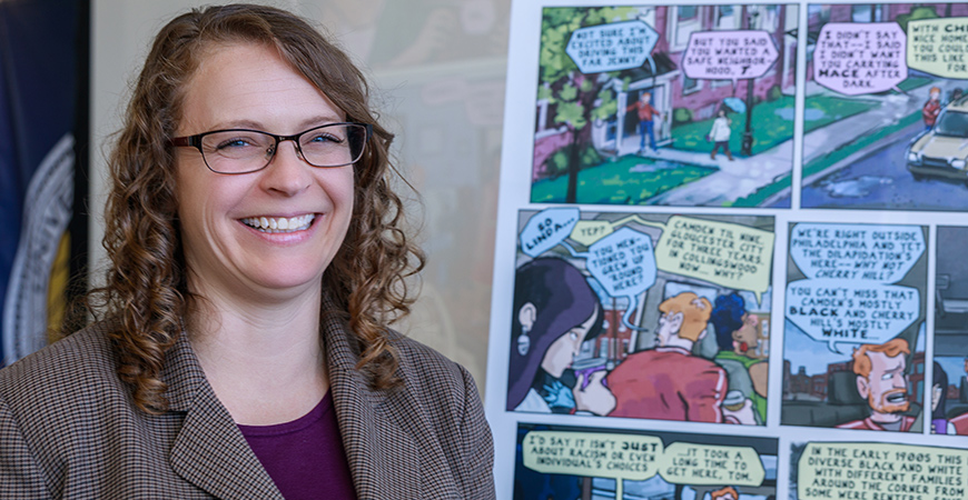 Professor Jessica Trounstine smiles while giving a presentation at UC Merced.